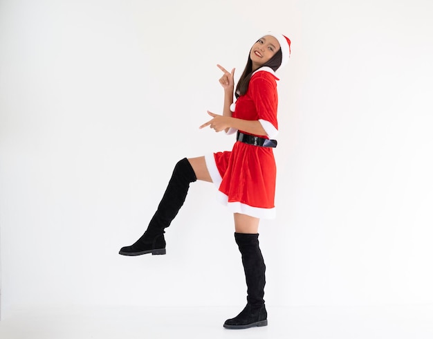 Happy Santa claus girl wear boot on white background.