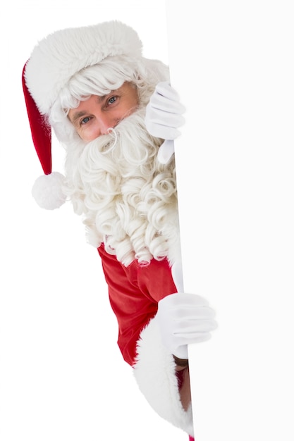 Happy santa claus holding poster