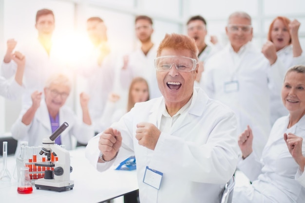 Happy scientific supervisor and its working group in the workplace