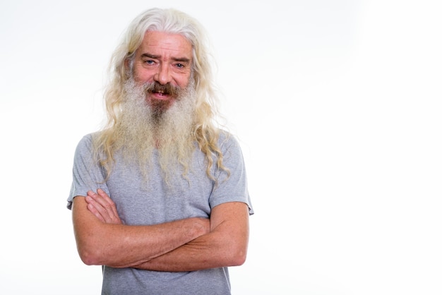 happy senior bearded man smiling with arms crossed