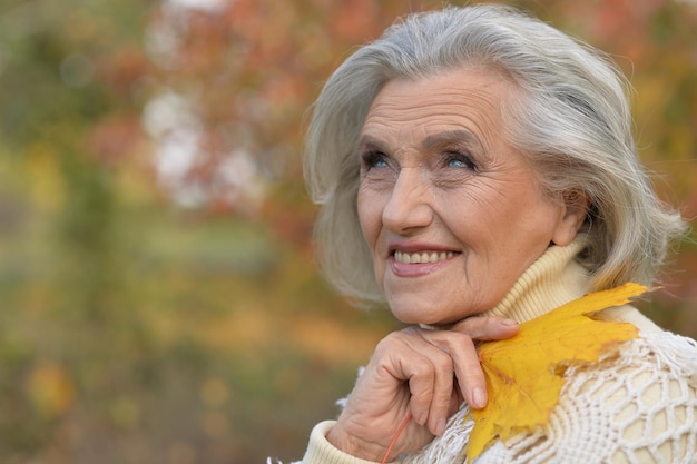 Happy senior beautiful woman in park