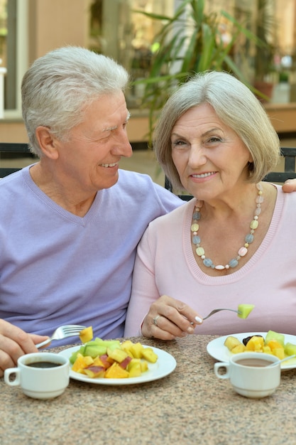 Happy Senior couple having breakfast in cafe