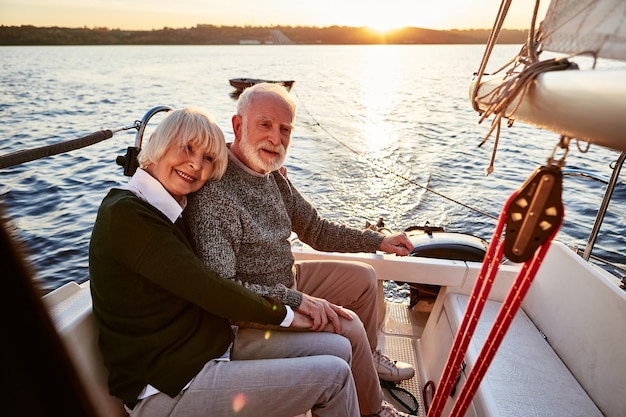 Happy senior couple in love elderly man and woman holding hands hugging and spending time together