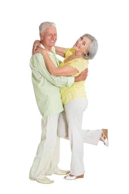 Happy senior couple posing isolated on white background