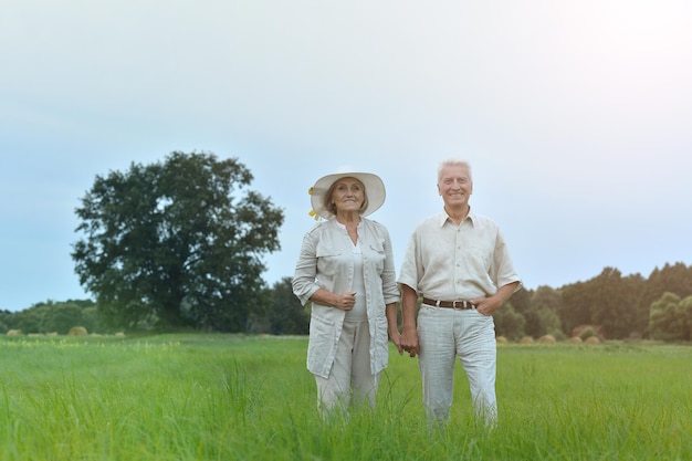 Happy senior couple posing outdoors