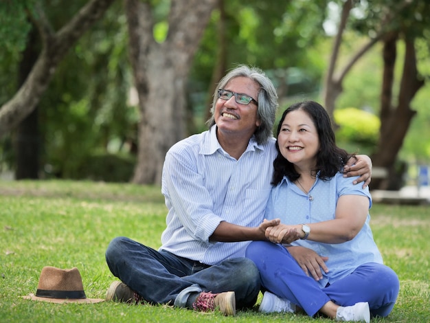 Happy senior couple spend the time together at the park in autumn.