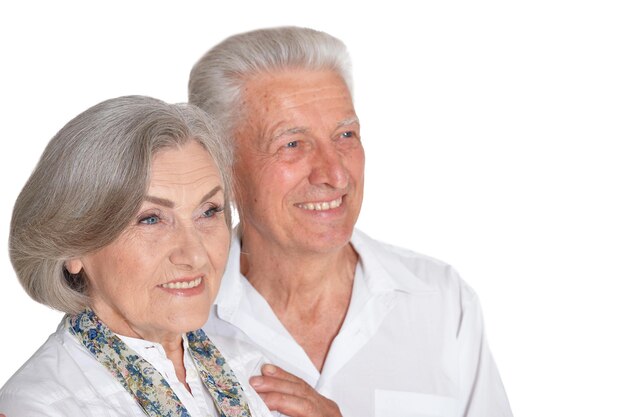 Happy senior couple on white background