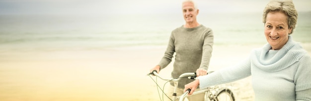 Happy senior couple with their bike