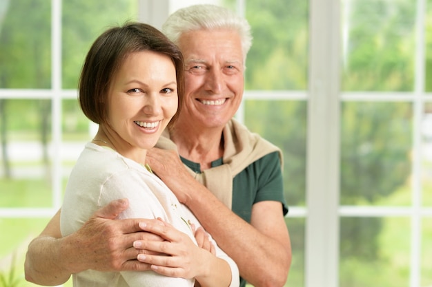 Happy senior father  with daughter at home