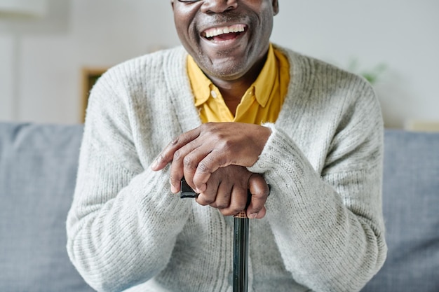 happy senior man with stick
