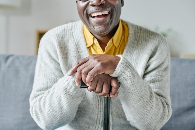 Happy senior man with stick