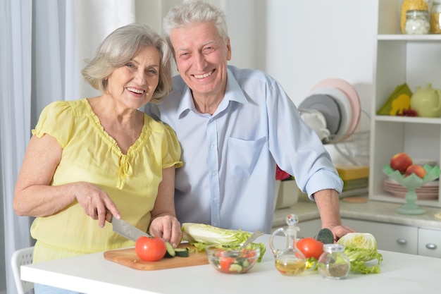 Happy senior man and woman  in the kitchen