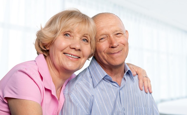 Happy senior old couple hugging