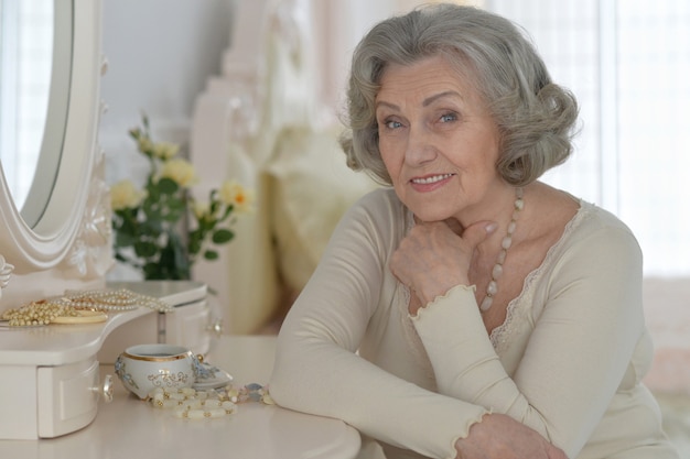 Happy Senior woman portrait with jewelry box