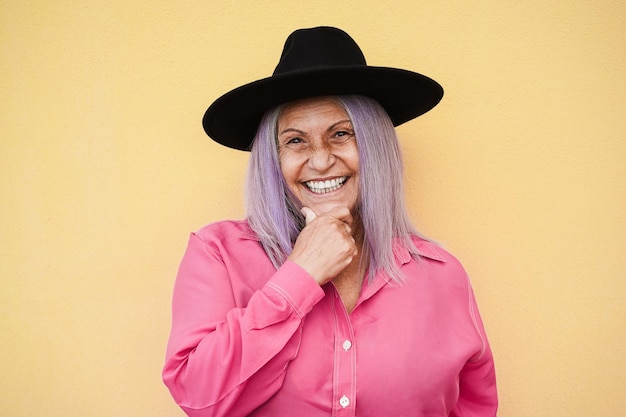 Happy senior woman smiling on camera - Focus on face