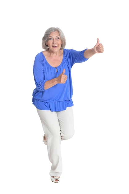 Happy senior woman with thumbs up