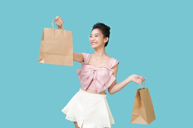 Happy shopping young woman with bags