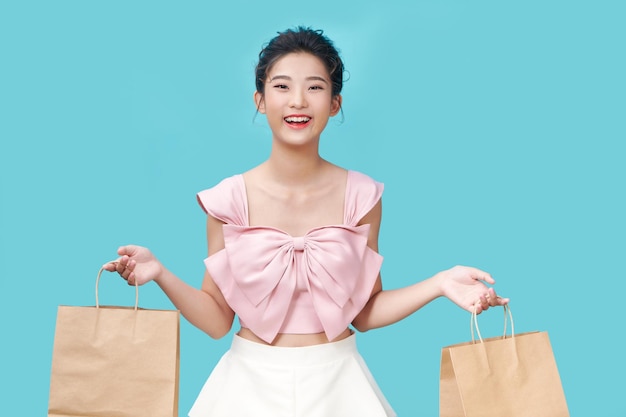 Happy shopping young woman with bags