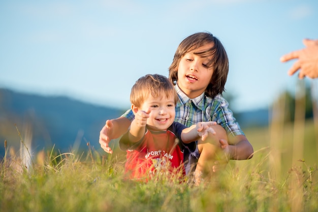 Happy siblings enjoying picnic together