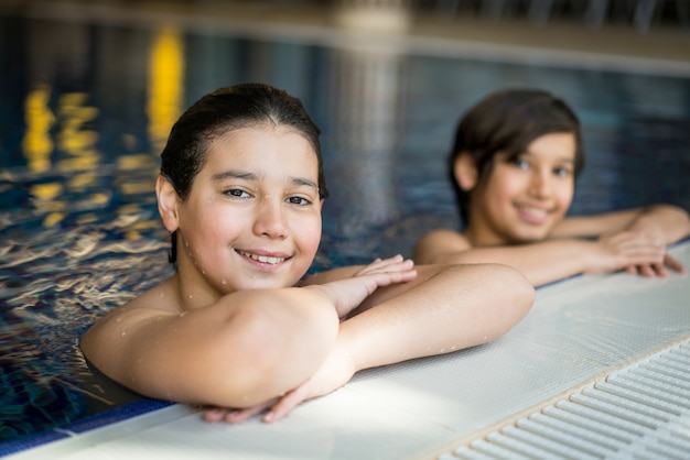 Happy siblings at the pool