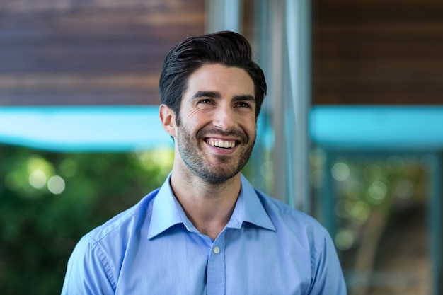 Happy smart man looking away