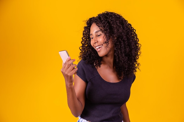 Happy smiling afro girl on a smartphone video call