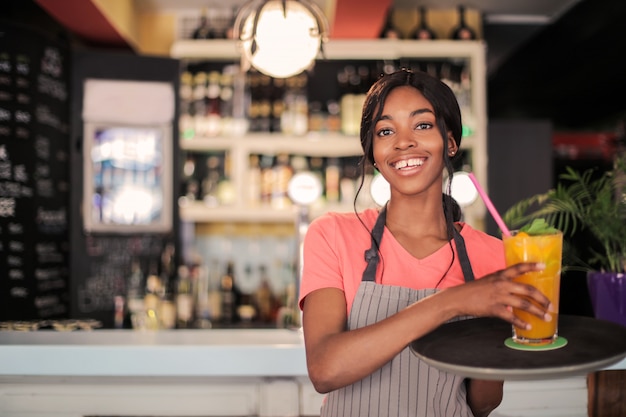 Happy smiling Afro waitress