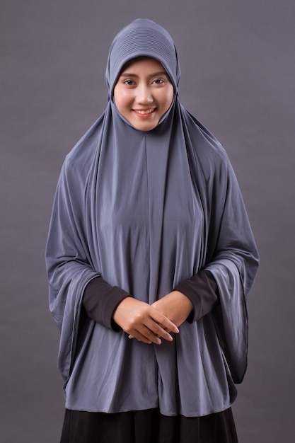 Happy smiling asian muslim woman studio isolated