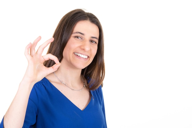 Happy smiling blurry woman fingers showing ok sign and looking at camera