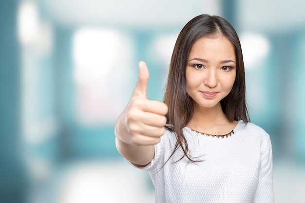 Happy smiling business woman with ok hand sign