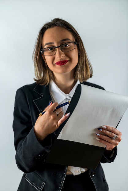 Happy smiling cheerful young business woman with clipboard isolated on white background