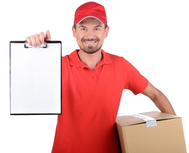 Happy smiling delivery man signing papers for delivery.