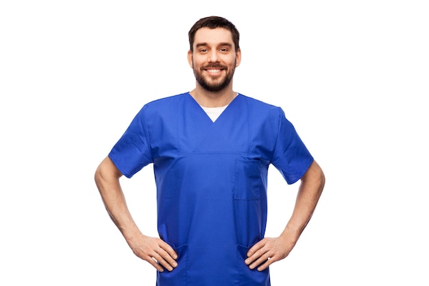 happy smiling doctor or male nurse in blue uniform