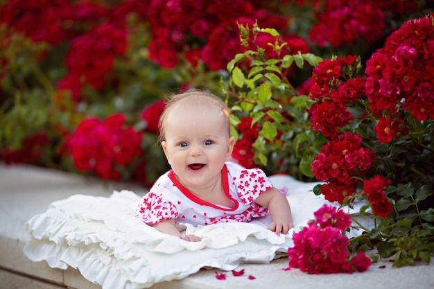 Happy smiling girl on the nature in the summer park.