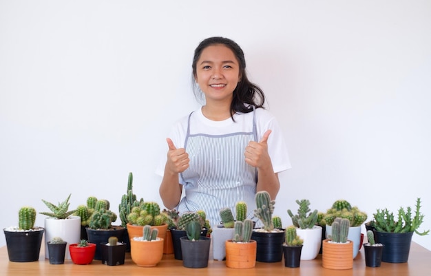 Happy smiling girl with cactus