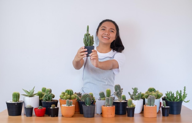 Happy smiling girl with cactus