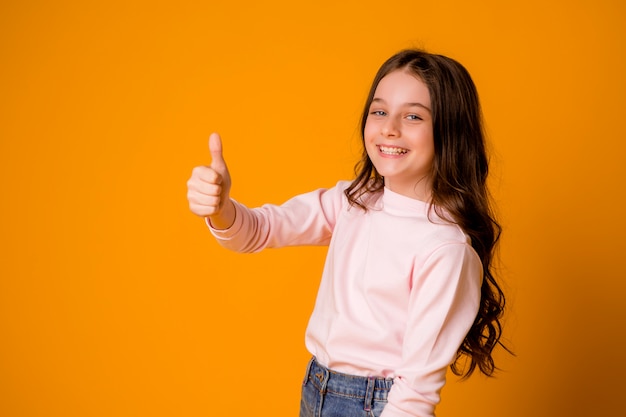 Happy and smiling girl with thumbs up