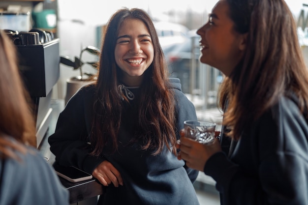 Happy smiling professional barista in cafe