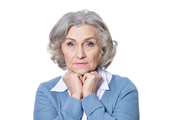 Happy smiling senior woman posing on white background