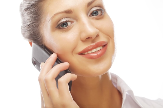 Happy smiling successful businesswoman with cell phone