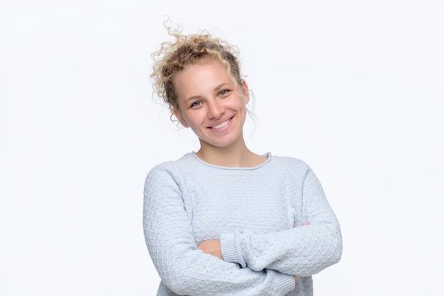 Happy smiling woman portrait with crossed arms being excited