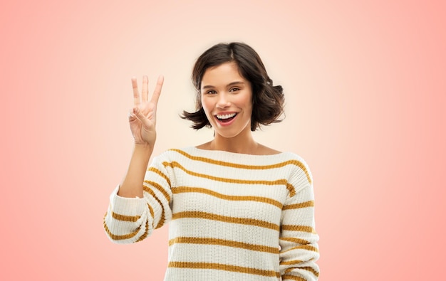 happy smiling woman showing three fingers