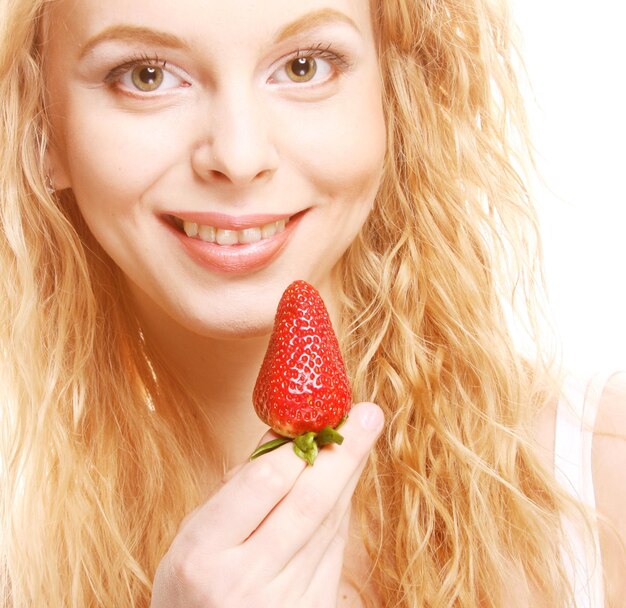 Happy smiling woman with strawberry