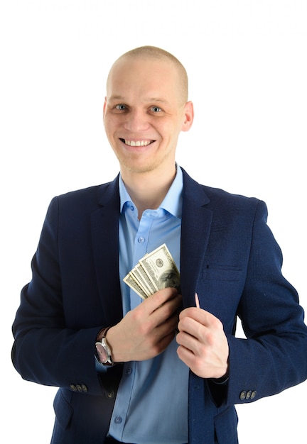 Happy smiling young Businessman putting money in his suit pocket