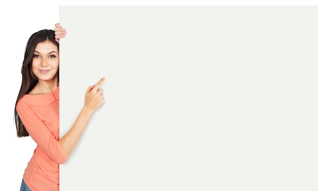 Happy smiling young  woman showing blank signboard, isolated on  background