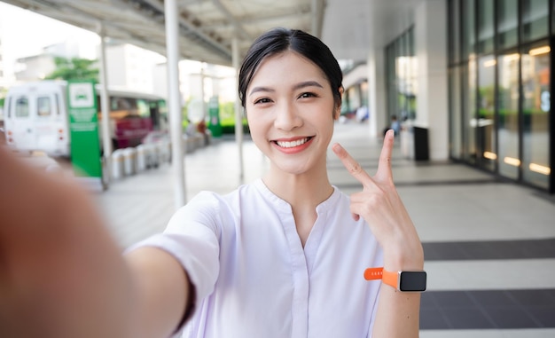 Happy smiling young woman on the street