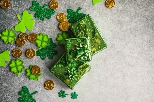 Happy st. Patrick's day. Card with  lucky clover, green gift box. Irish festival symbol. Lucky concept. St. Patrick's day background with gift. Copy space.