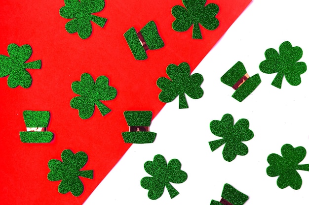 Happy St Patricks Day Shamrocks and leprechaun hats pattern on white and orange background Patrick Day symbols on Ireland flag background