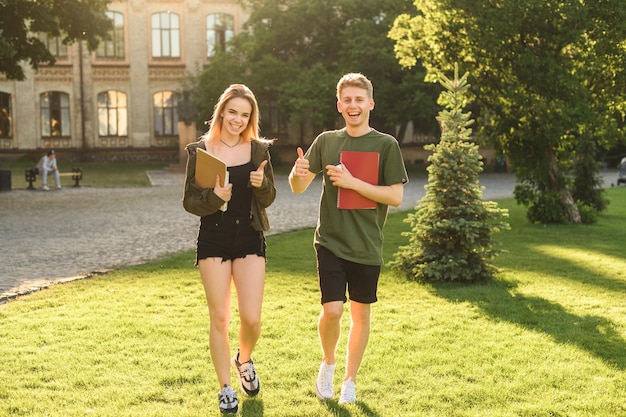 Happy student apparatus walking in the park