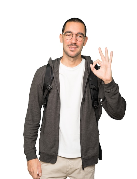 Happy student doing an all right gesture